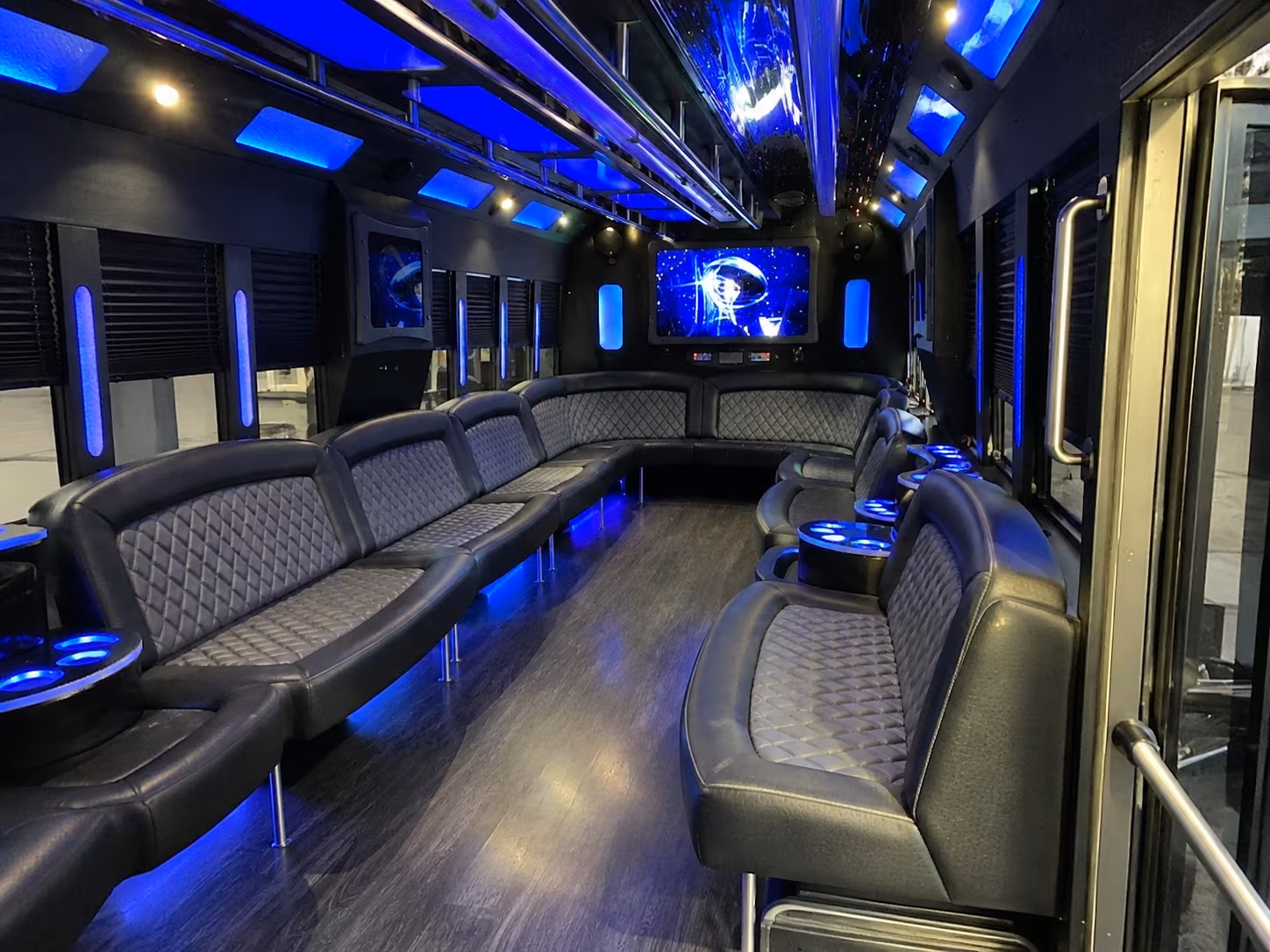 Friends laughing during a party bus celebration in Rancho Cucamonga